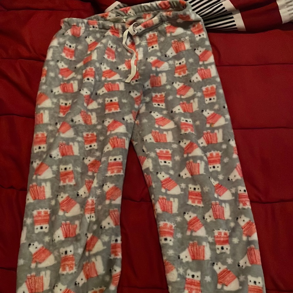 Fuzzy pajama pants with polar bear pattern.